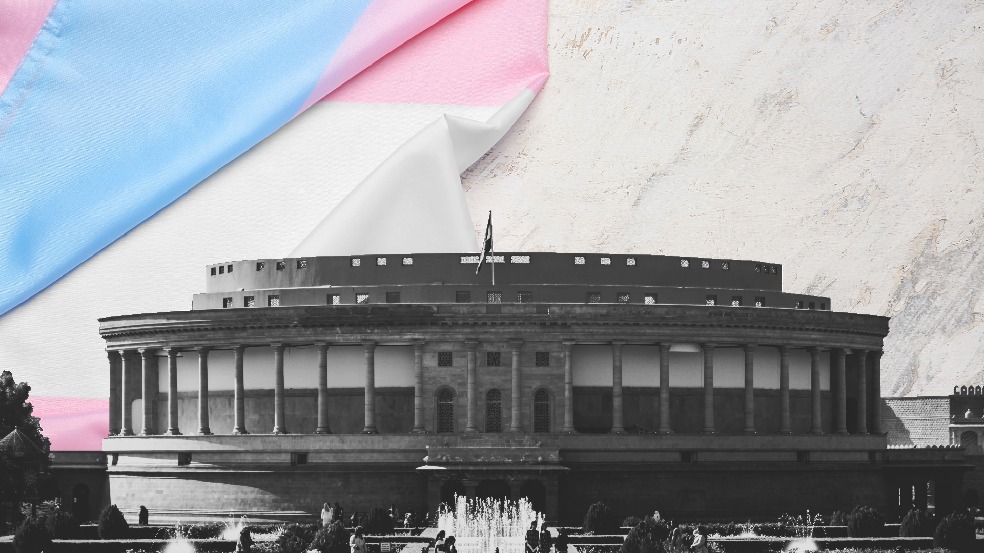 A trans flag lies behind a greyscale image of the Parliament of India
